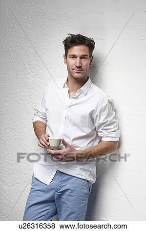 Man drinking cup of coffee View Large Photo Image Stock Photo - Man drinking cup of coffee. Fotosearch