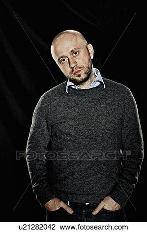 Man standing with hands in pockets View Large Photo Image Stock Image - Man standing with hands in pockets. Fotosearch
