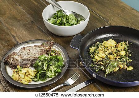 Meat, vegetables and potatoes on table View Large Photo Image Stock Photography - Meat, vegetables and potatoes on table. Fotosearch