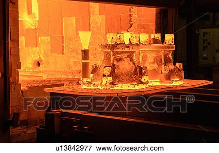Metal casings glowing in foundry View Large Photo Image Stock Photo - Metal casings glowing in foundry. Fotosearch