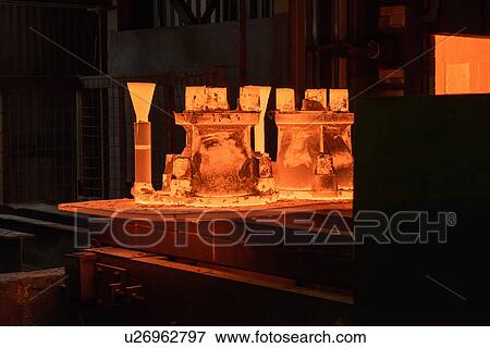 Metal casings glowing in foundry View Large Photo Image Stock Photo - Metal casings glowing in foundry. Fotosearch