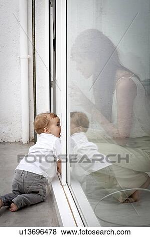 Mother and son playing in door View Large Photo Image Stock Photo - Mother and son playing in door. Fotosearch
