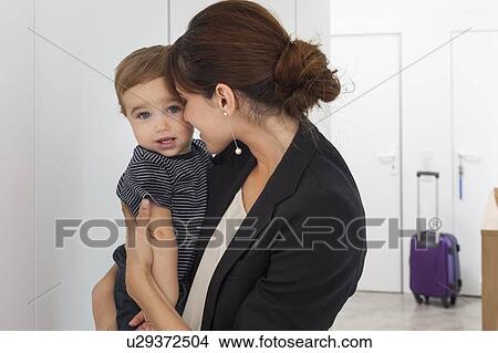Mother returning from business trip View Large Photo Image Picture - Mother returning from business trip. Fotosearch