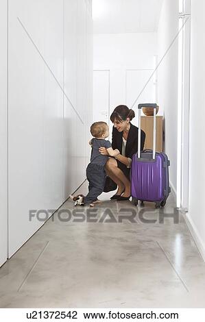 Mother returning from business trip View Large Photo Image Stock Image - Mother returning from business trip. Fotosearch
