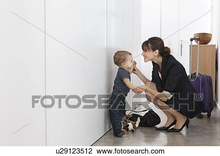 Mother returning from business trip View Large Photo Image Stock Image - Mother returning from business trip. Fotosearch