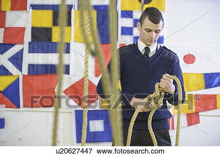 Stock Photo - Nautical student learning to splice rope. Fotosearch