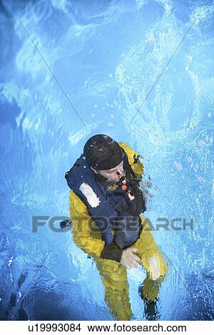 Picture - Oil worker learning survival strategies. Fotosearch