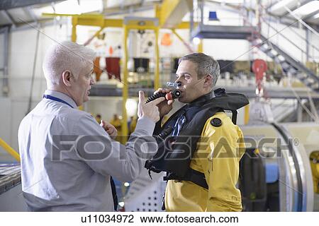 Oil worker learning survival strategies View Large Photo Image Stock Image - Oil worker learning survival strategies. Fotosearch