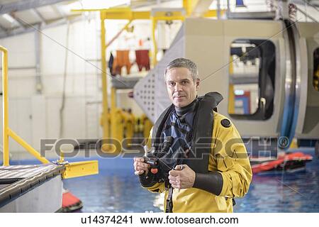 Oil worker learning survival strategies View Large Photo Image Stock Image - Oil worker learning survival strategies. Fotosearch