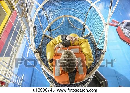 Oil worker training in escape net View Large Photo Image Stock Photography - Oil worker training in escape net. Fotosearch