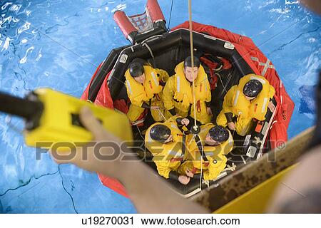 Oil workers learning survival strategies View Large Photo Image Stock Image - Oil workers learning survival strategies. Fotosearch