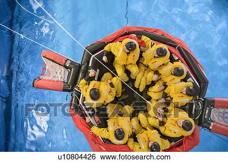 Stock Photograph - Oil workers learning survival strategies. Fotosearch