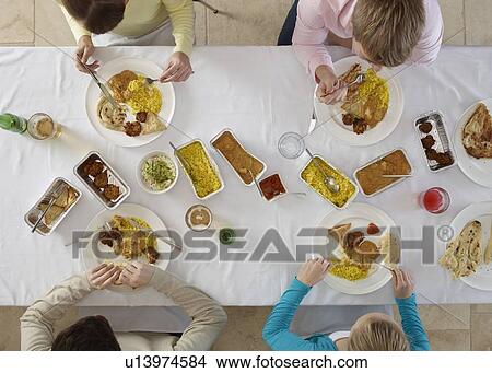 Overhead view of people at table View Large Photo Image Picture - Overhead view of people at table. Fotosearch