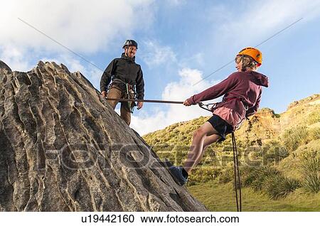 People abseiling in rock climbing lesson View Large Photo Image Stock Image - People abseiling in rock climbing lesson. Fotosearch