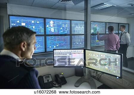 Personnel working in ships engine room View Large Photo Image Stock Photo - Personnel working in ships engine room. Fotosearch