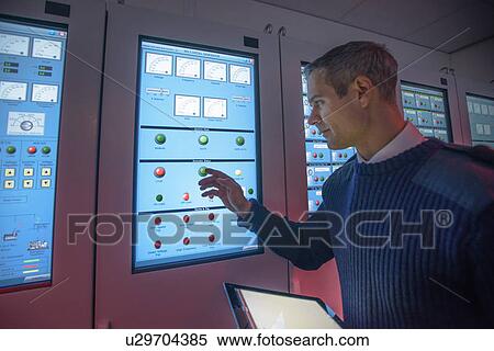 Personnel working in ships engine room View Large Photo Image Stock Photography - Personnel working in ships engine room. Fotosearch