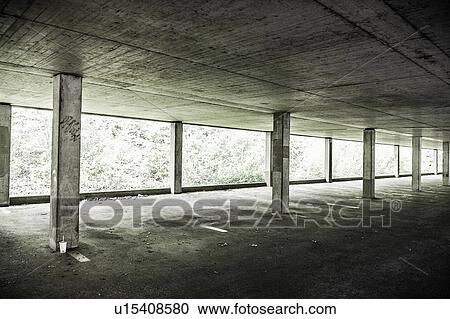 Pillars in empty parking structure View Large Photo Image Stock Image - Pillars in empty parking structure. Fotosearch