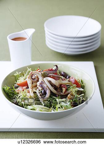 Stock Photograph - Plate of squid with endive salad. Fotosearch