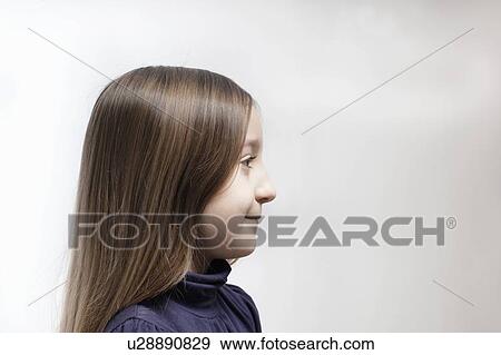 Profile view of girls smiling face View Large Photo Image Stock Photo - Profile view of girls smiling face. Fotosearch