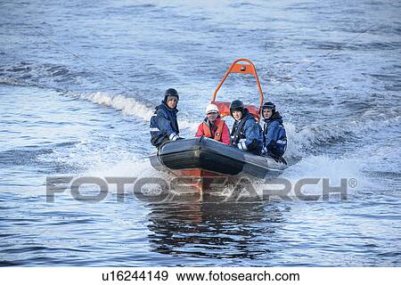 Stock Photo - Rescue boat training in open water. Fotosearch