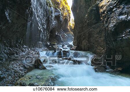 River rushing through rocky canyon View Large Photo Image Picture - River rushing through rocky canyon. Fotosearch