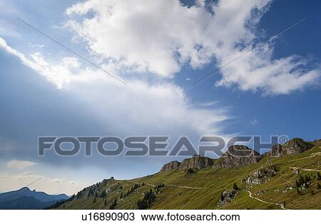 Stock Image - Rocky hilltop and blue sky. Fotosearch