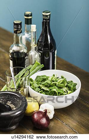 Stock Image - Salad with toppings and dressings. Fotosearch