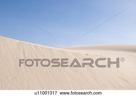 Stock Photo - Sand dunes in desert landscape. Fotosearch