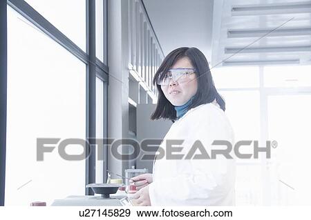 Scientist working in lab View Large Photo Image Stock Photo - Scientist working in lab. Fotosearch