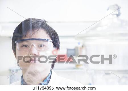 Stock Photography - Scientist working in lab. Fotosearch