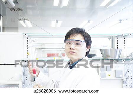 Stock Photography - Scientist working in lab. Fotosearch