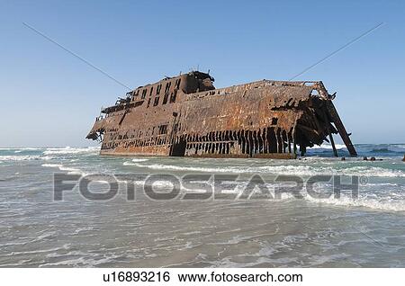 Shipwreck stranded on beach View Large Photo Image Stock Photograph - Shipwreck stranded on beach. Fotosearch