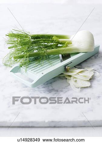 Sliced leeks with mandarin on counter View Large Photo Image Stock Photo - Sliced leeks with mandarin on counter. Fotosearch