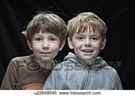 Smiling boys sitting together View Large Photo Image Stock Photography - Smiling boys sitting together. Fotosearch