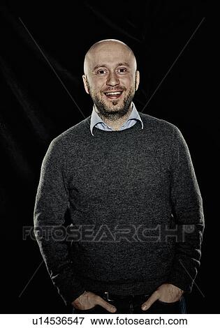 Smiling man with hands in pockets View Large Photo Image Stock Photo - Smiling man with hands in pockets. Fotosearch