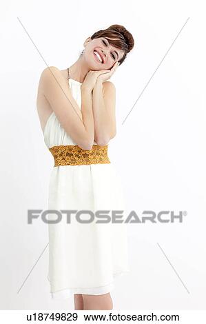 Smiling woman resting head in hands View Large Photo Image Stock Photo - Smiling woman resting head in hands. Fotosearch