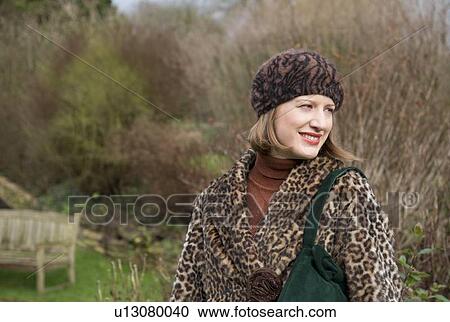 Smiling woman walking in forest View Large Photo Image Stock Image - Smiling woman walking in forest. Fotosearch