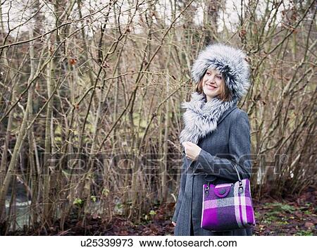 Smiling woman walking in forest View Large Photo Image Stock Image - Smiling woman walking in forest. Fotosearch