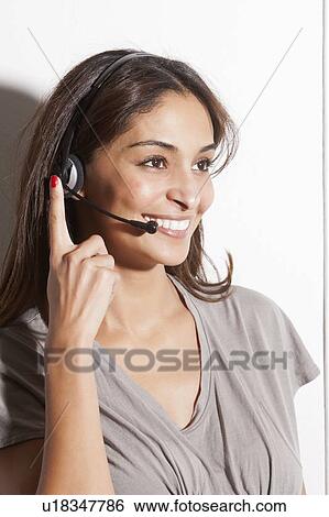 Smiling woman wearing headset View Large Photo Image Stock Photograph - Smiling woman wearing headset. Fotosearch