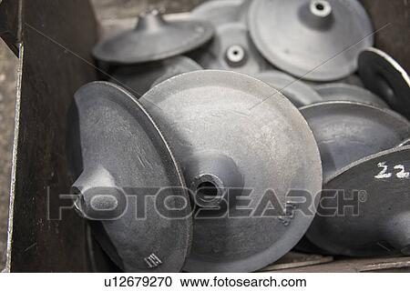 Stock Image - Steel parts in metal foundry. Fotosearch