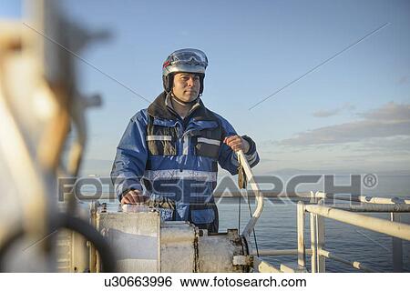 Stock Photograph - Student at rescue boat training. Fotosearch