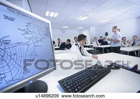 Stock Photo - Students in shipping training room. Fotosearch