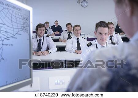 Stock Photo - Students in shipping training room. Fotosearch