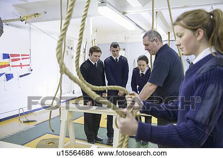 Stock Photograph - Teacher demonstrating nautical knots. Fotosearch