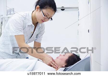 Technician with patient in CT scanner View Large Photo Image Stock Image - Technician with patient in CT scanner. Fotosearch