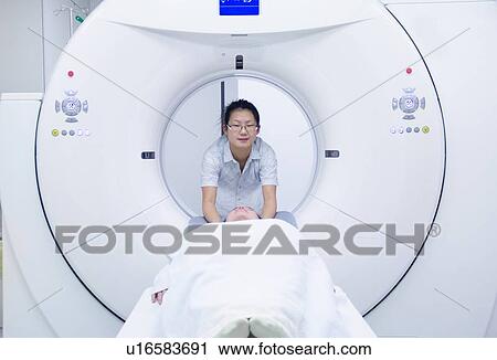 Technician with patient in CT scanner View Large Photo Image Stock Image - Technician with patient in CT scanner. Fotosearch