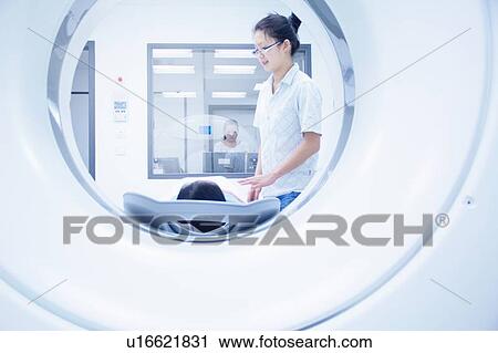 Technician with patient in CT scanner View Large Photo Image Stock Image - Technician with patient in CT scanner. Fotosearch