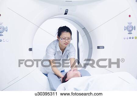 Technician with patient in CT scanner View Large Photo Image Stock Image - Technician with patient in CT scanner. Fotosearch