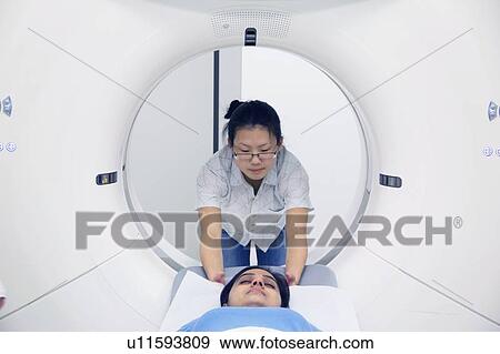 Technician with patient in CT scanner View Large Photo Image Stock Photo - Technician with patient in CT scanner. Fotosearch