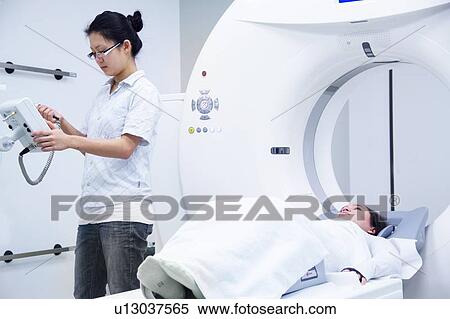Technician with patient in CT scanner View Large Photo Image Stock Photography - Technician with patient in CT scanner. Fotosearch